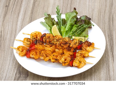 Grilled tiger prawn skewer with rosemary and spices