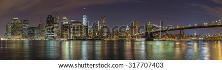 Manhattan skyline at night, New York City panoramic picture, USA.