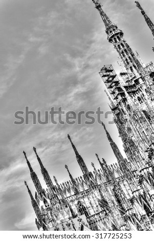 HDR photo of the famous Cathedral Duomo di Milano on piazza in Milan, Italy, during a sunny nice day