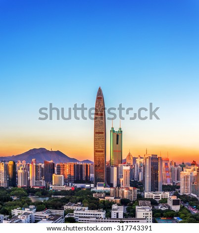 panorama of skyscrapers in a modern city under blue sky