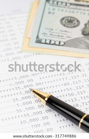Bank account passbook with pen and dollar banknote