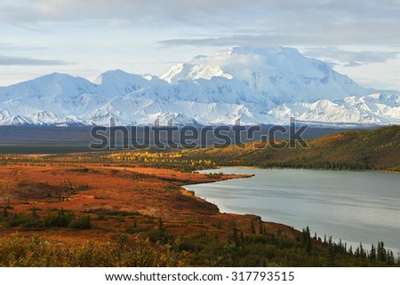 Denali Mountain and Wonder Lake at sunrise, Alaska Royalty-Free Stock Photo #317793515