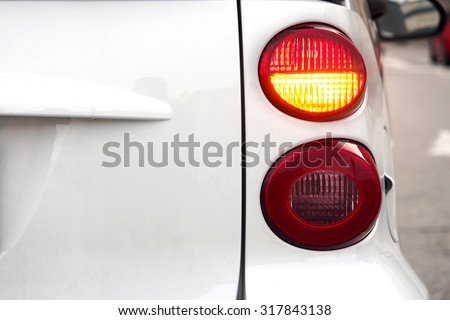 Car. Flashing turn signal indicating the right direction.    Royalty-Free Stock Photo #317843138