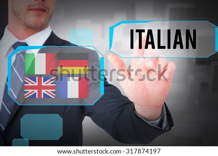 The word italian and focused businessman pointing with his finger against room with floating cubes