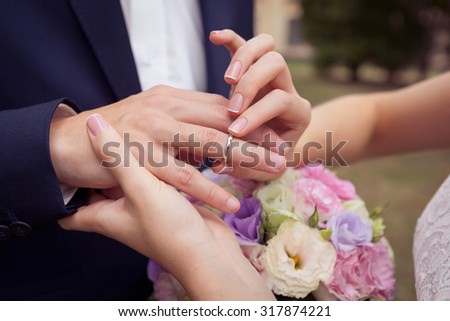 buttoning wedding dress, arms with buttons