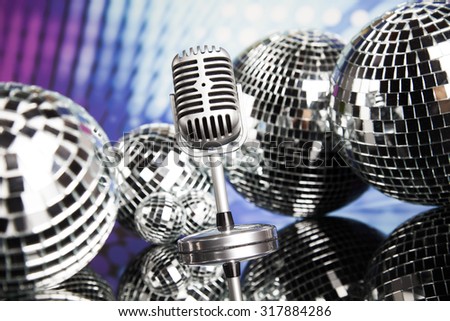 Retro style microphone on sound waves and Disco Balls