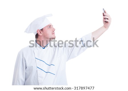 Chef or cook taking a selfie with phone camera isolated on white
