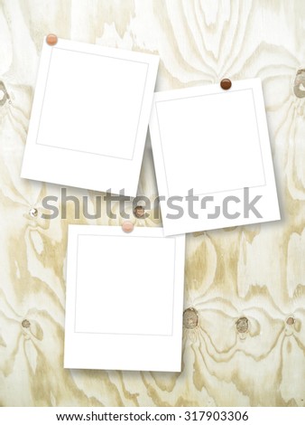 Digital background: three blank square instant photo frames with pins gray yellow ochre brown white-grungy scratched wooden board background