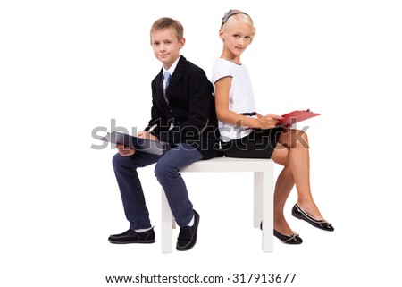 Students in business suits on white background discussing a startup, picture with depth of field and artistic blur
