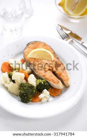 Grilled fish in a frying pan, famous food recipes of traditional cuisine