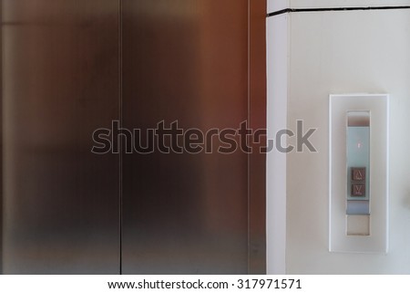 elevator button up and down, modern metal elevator close door in building office