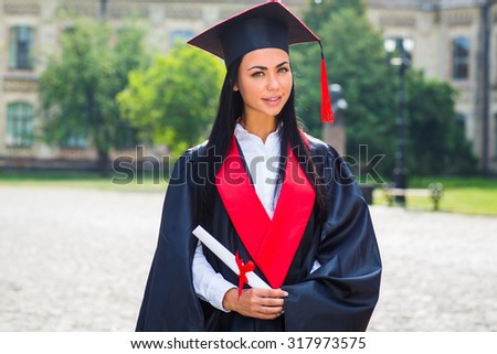 Happy woman portrait on her graduation day smiling