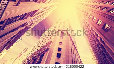Vintage filtered photo of skyscrapers in Manhattan at sunset, New York City, USA.