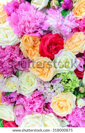 floral arrangement of colorful peonies and roses for event or wedding celebration