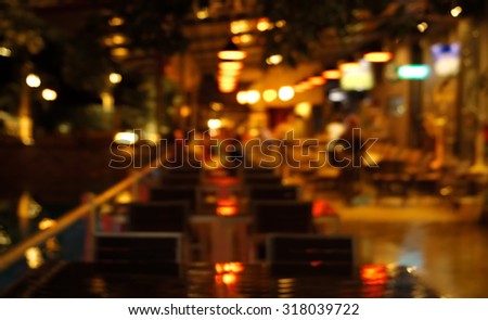 blur light in pub or bar and restaurant at night party background Royalty-Free Stock Photo #318039722