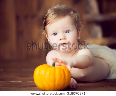 baby and pumpkin