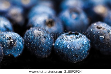 natural fresh blueberries closeup on dark background