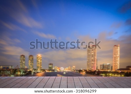 abstract city blur background and wood floor