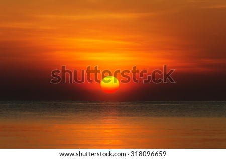 Red sunset over the sea, rays of light