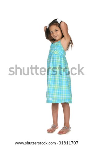 cute young girl in blue dress with arms up