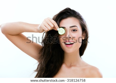 Girl with cucumber