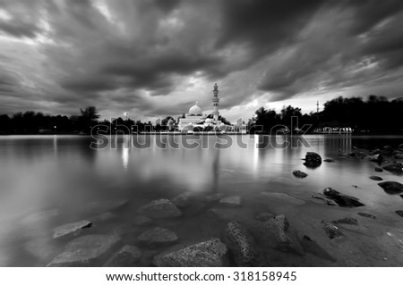 Long exposure in black and white view at Tengku Tengah Zaharah Mosque. Image has certain grain, noise and soft focus when view at full resolution.