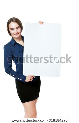 Portrait of an attractive young business woman in glasses holding blank card - over white background