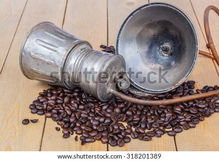 Coffee beans in a bamboo basket and old style Wick