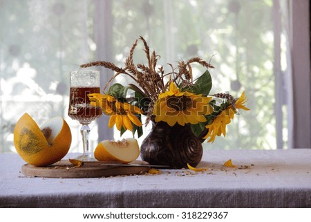 Melon, sunflowers and wine
