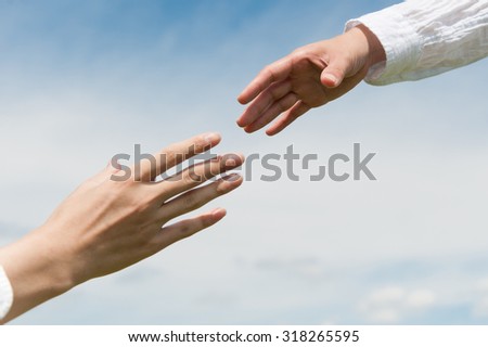 A man and woman shaking hands
