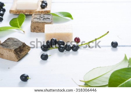 salt and milk soaps, hair colourant henna blocks on white wooden table
