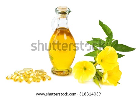 Evening primroses with gelatine capsules and oil bottle on white background Royalty-Free Stock Photo #318314039