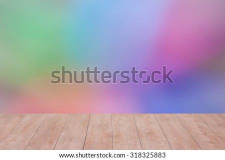 Wood table top on color abstract blurred background. ready for product display
