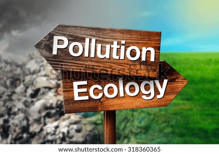 Pollution or Ecology Concept of Choice, Rustic Opposite Direction Wooden Sign Pointing to Garbage Dump and Clean Beautiful Grassland Field