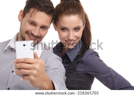 Young couple take selfie, studio isolated shoot