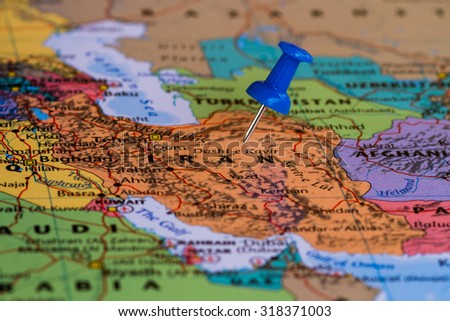 Map of Iran with a blue pushpin stuck