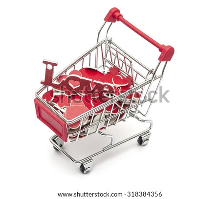 Supermarket trolley full of red hearts on white background