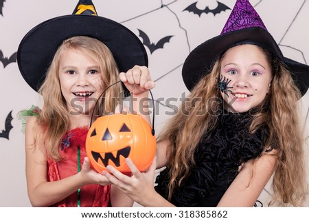 Two happy sisters on Halloween party