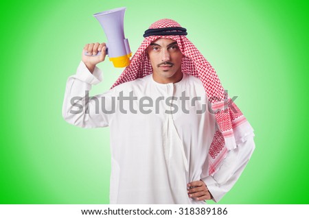 Arab man shouting through loudspeaker Royalty-Free Stock Photo #318389186