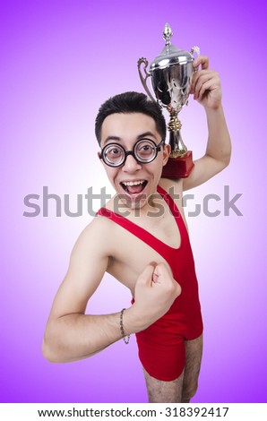Funny wrestler with winners cup