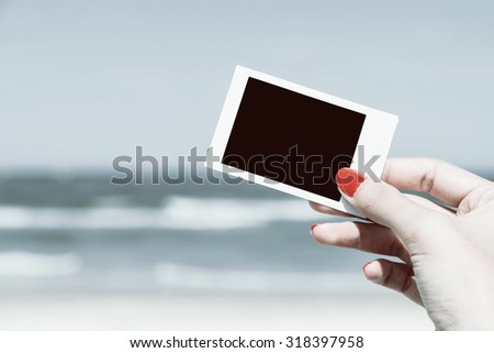 Retro Photo Of Girl Hand Holding Blank Card On Summer Beach