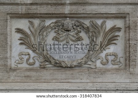 Bas relief near entrance to Papal Archbasilica of St. John in the Lateran  in Rome, Italy. Italian: Arcibasilica Papale di San Giovanni in Laterano. ,Also known as St. John Lateran Archbasilica