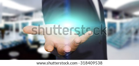 Businessman in his office holding with powerful light in his hand