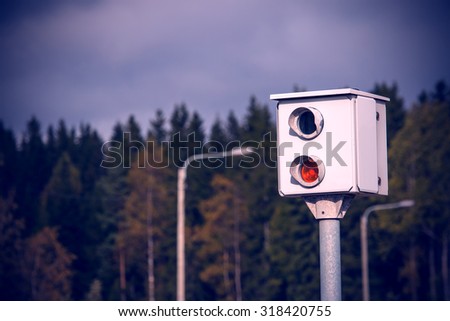 Speed camera on the road in Finland. Image includes a effect.