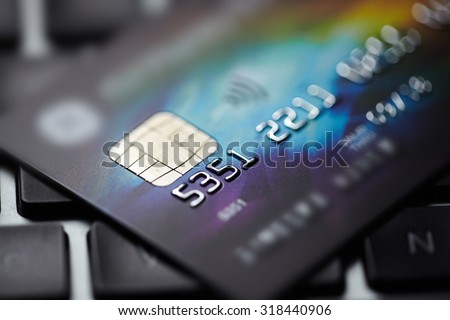 Low key macro shot with credit card. Royalty-Free Stock Photo #318440906