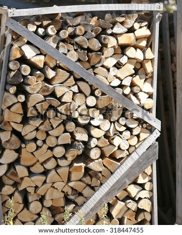 big pile of firewood to the wood oven pizzeria
