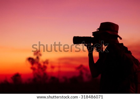 Blur photographer take a picture silhouette  sunset