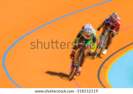 Bike race on velodrome track blurry for background