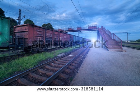 Cargo train platform at sunset. Railroad in Ukraine. Railway station.