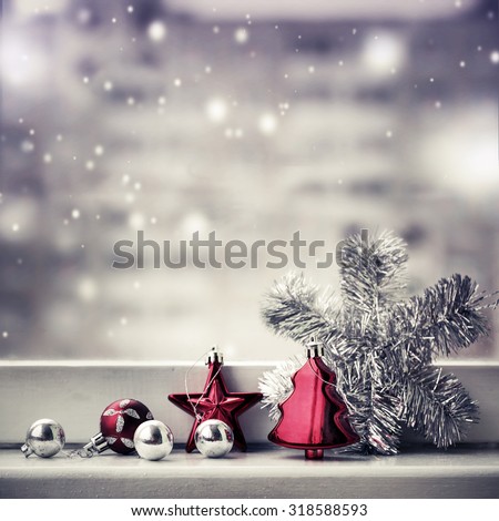Vintage Christmas background with Christmas decoration against winter window